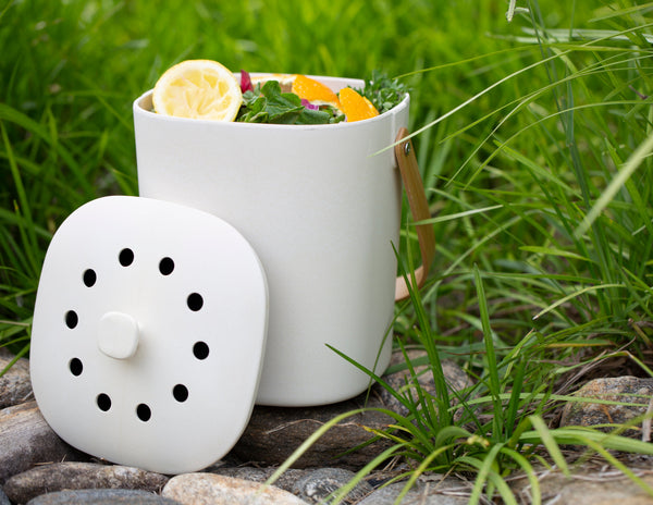 The Bamboozle Composter is a stylish and easy-to-use countertop compost bin that helps you reduce your food waste and help the environment. Made from bamboo fiber, this composter is dishwasher-safe, durable and sustainable. Dimensions: 8” x 6.25” x 9”. Order your Bamboozle Composter today!