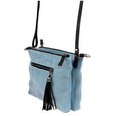 Light blue crossbody bag with black straps and tassel on a white background