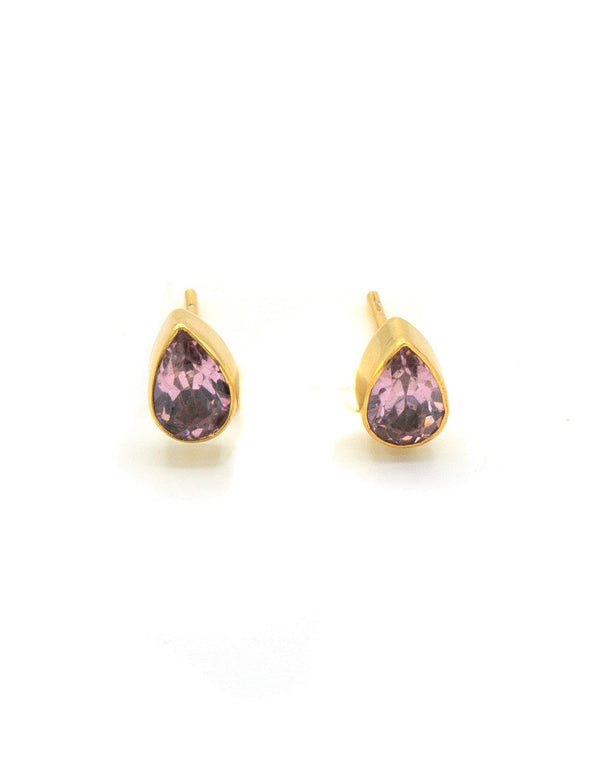 Close-up of pink zircon faceted teardrop stud earrings handcrafted by women artisans in India