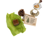 Raw filtered Picea abies spruce resin chunk next to a small weighing scale showing 1oz