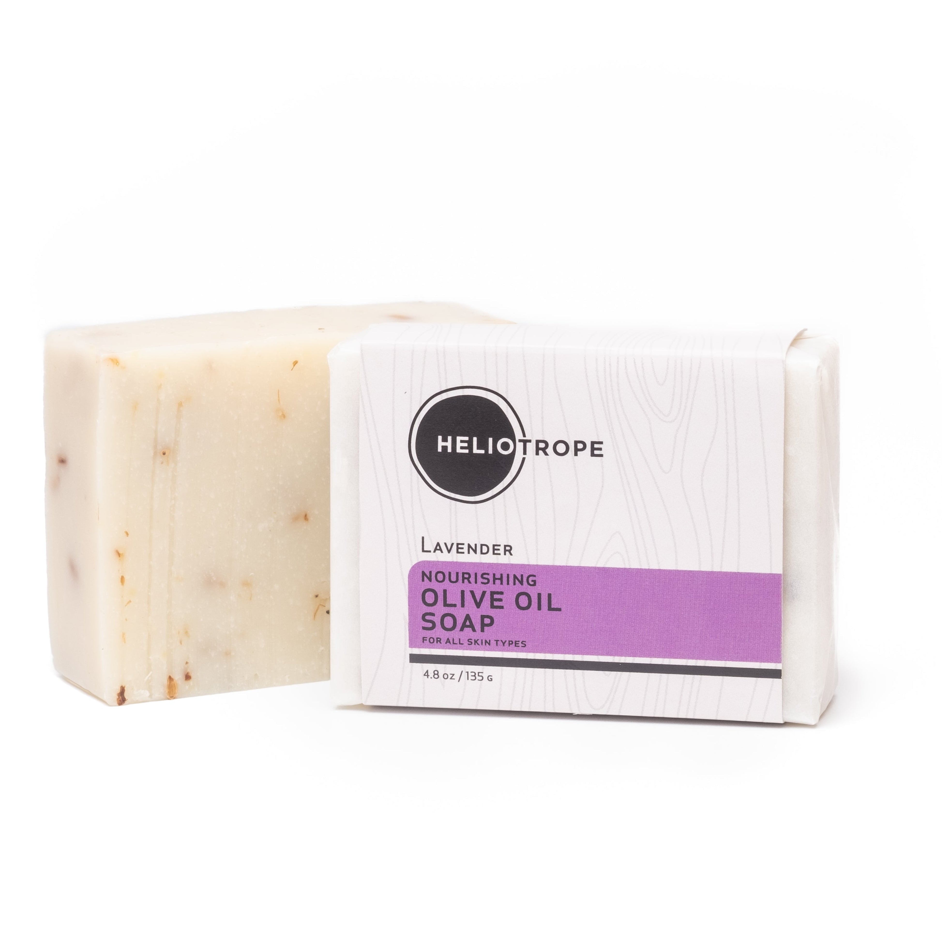 Bar of soap with a Heliotrope label on a white background
