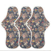 Three floral-patterned sanitary pads on a white background
