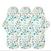 Three floral-patterned pads on a white background