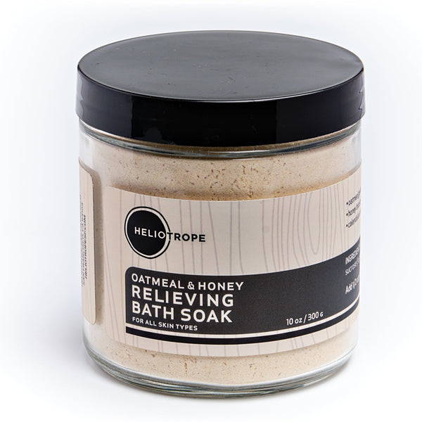 Heliotrope SF Oatmeal and Honey Relieving Bath Soak in a 10 oz glass jar with natural ingredients including epsom salt and calendula