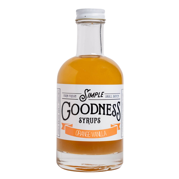 A bottle of Simple Goodness Syrups Orange Vanilla flavor, containing amber-colored syrup, with a white label and silver cap, on a plain white background.