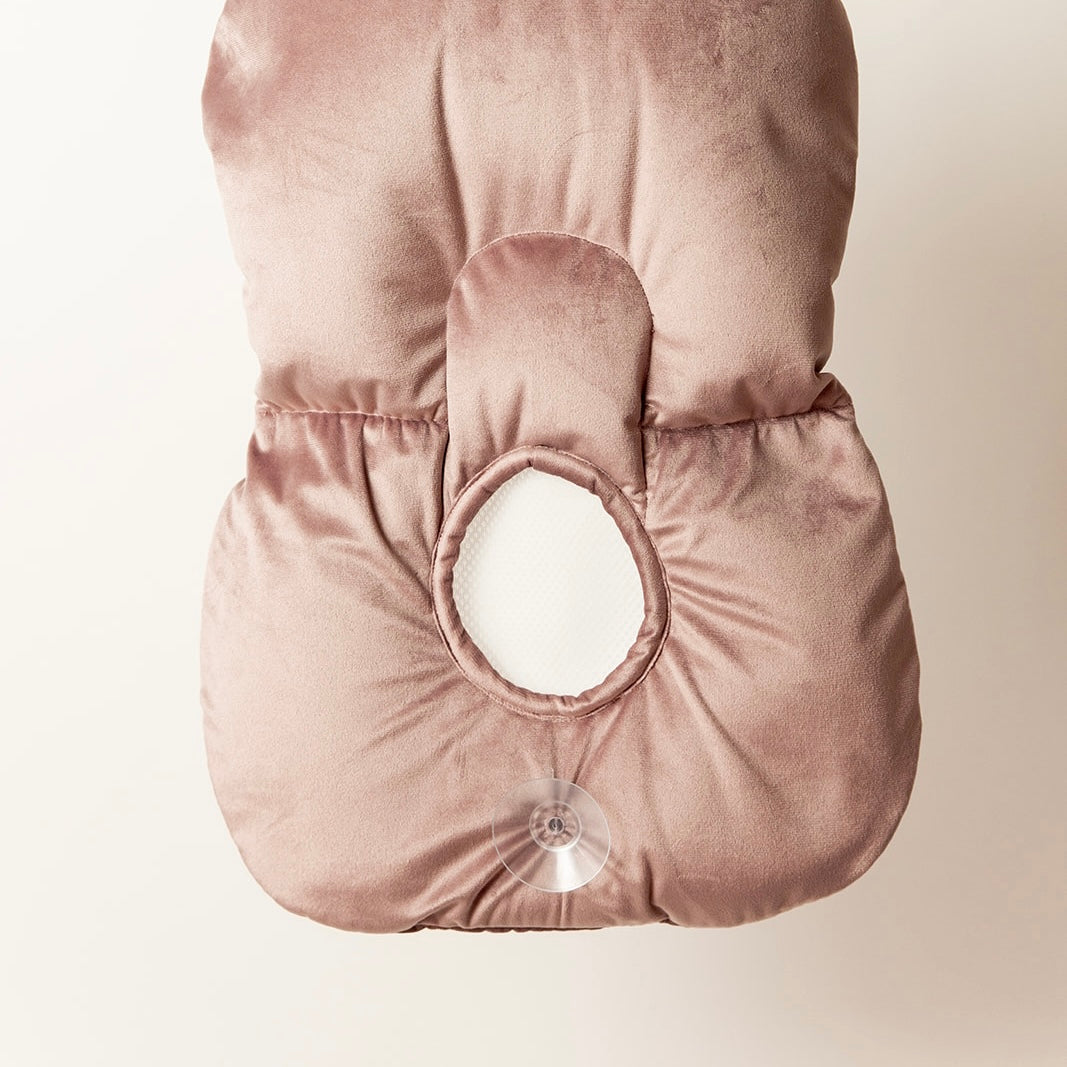 Infant Sink Bather in Orchid Haze hanging to dry on an S-hook, showing portable and lightweight design for newborn bathing