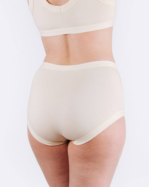 Beige high-waisted underwear on a white background