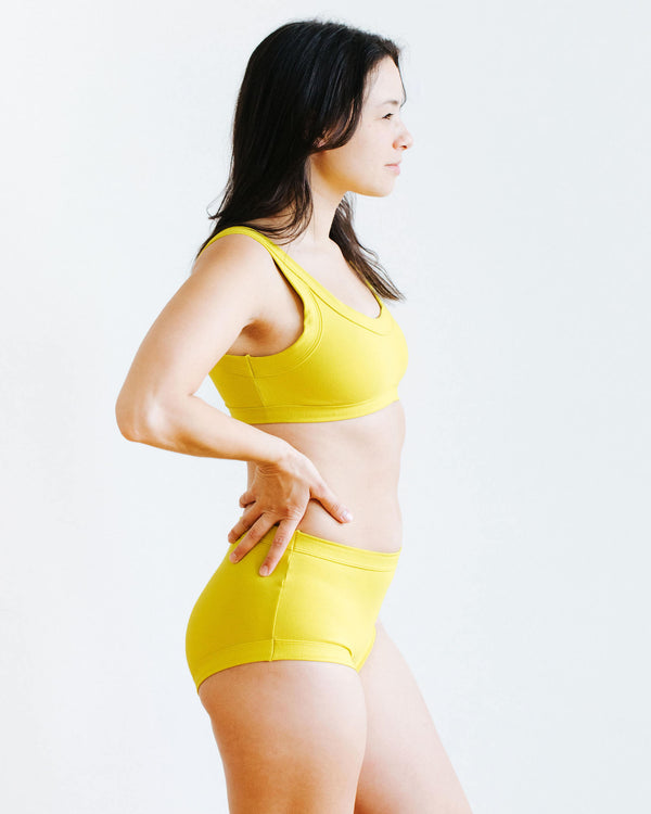 Close-up of Thunderpants Star Fruit Original underwear showing vibrant yellow chartreuse colour and fabric detail