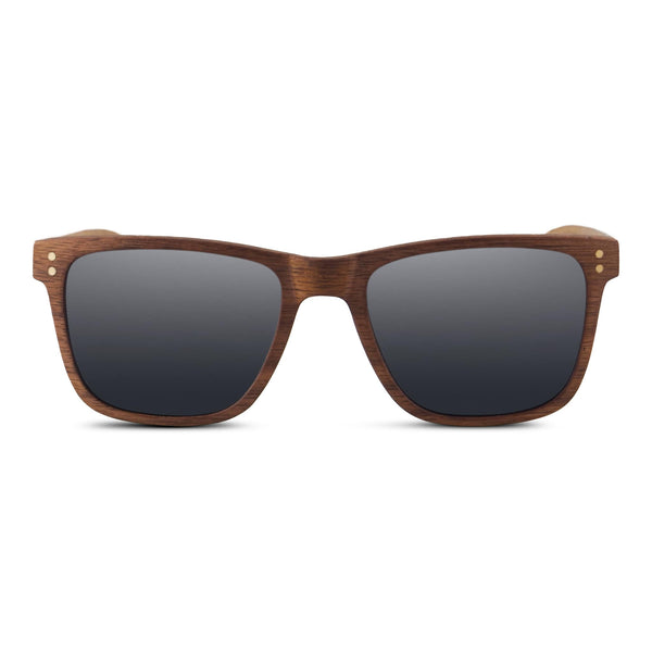 Walnut Wayfinder wooden sunglasses with polarized grey lenses, angled three-quarter view