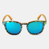 Sunglasses with blue lenses and a patterned frame on a white background