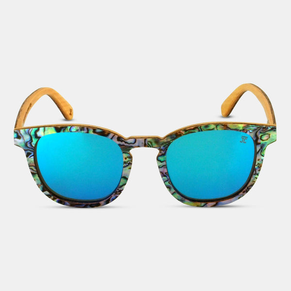 Sunglasses with blue lenses and a patterned frame on a white background