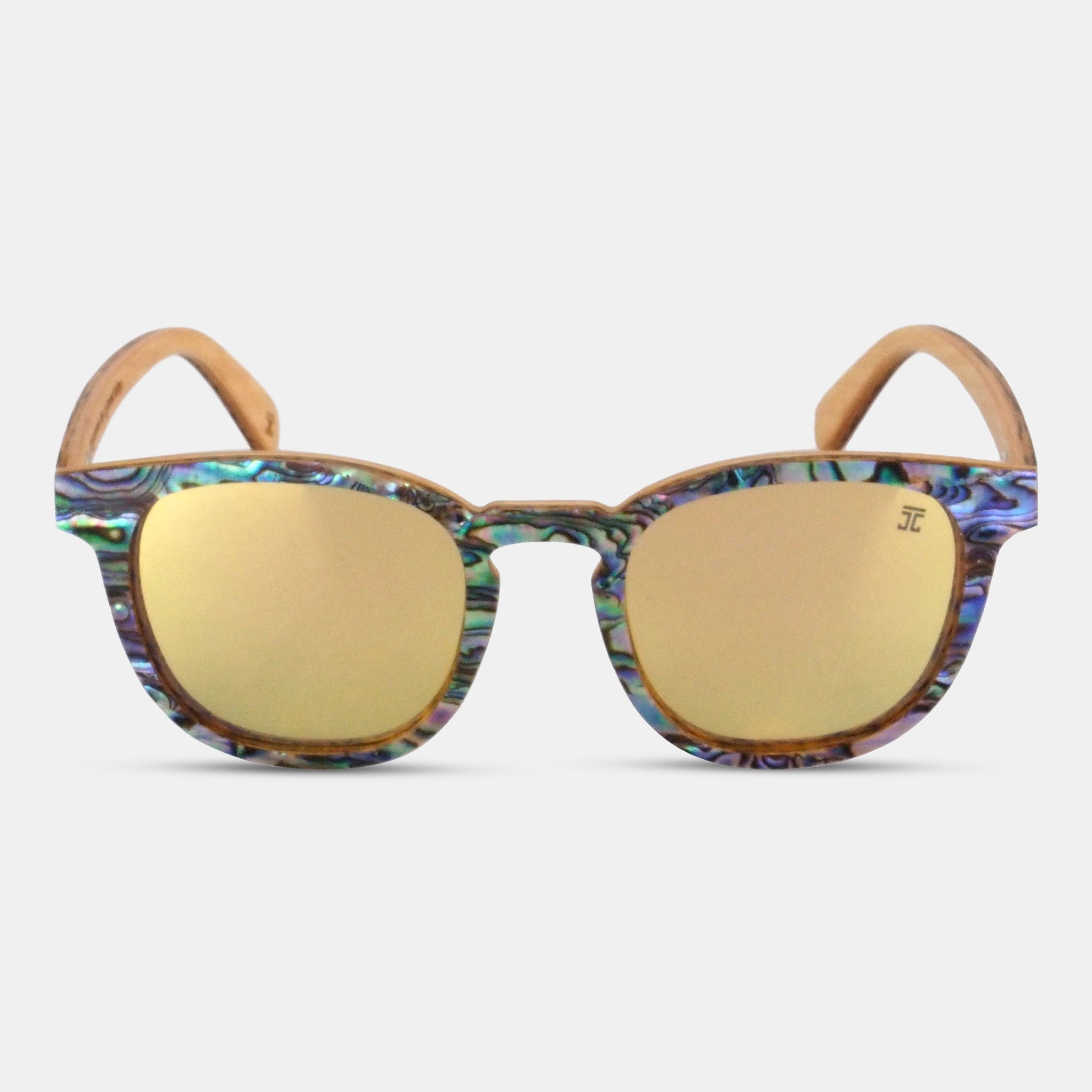 Sunglasses with colorful frame and gold lenses on a white background