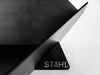Black metal object with 'STRAHL' branding on a white background