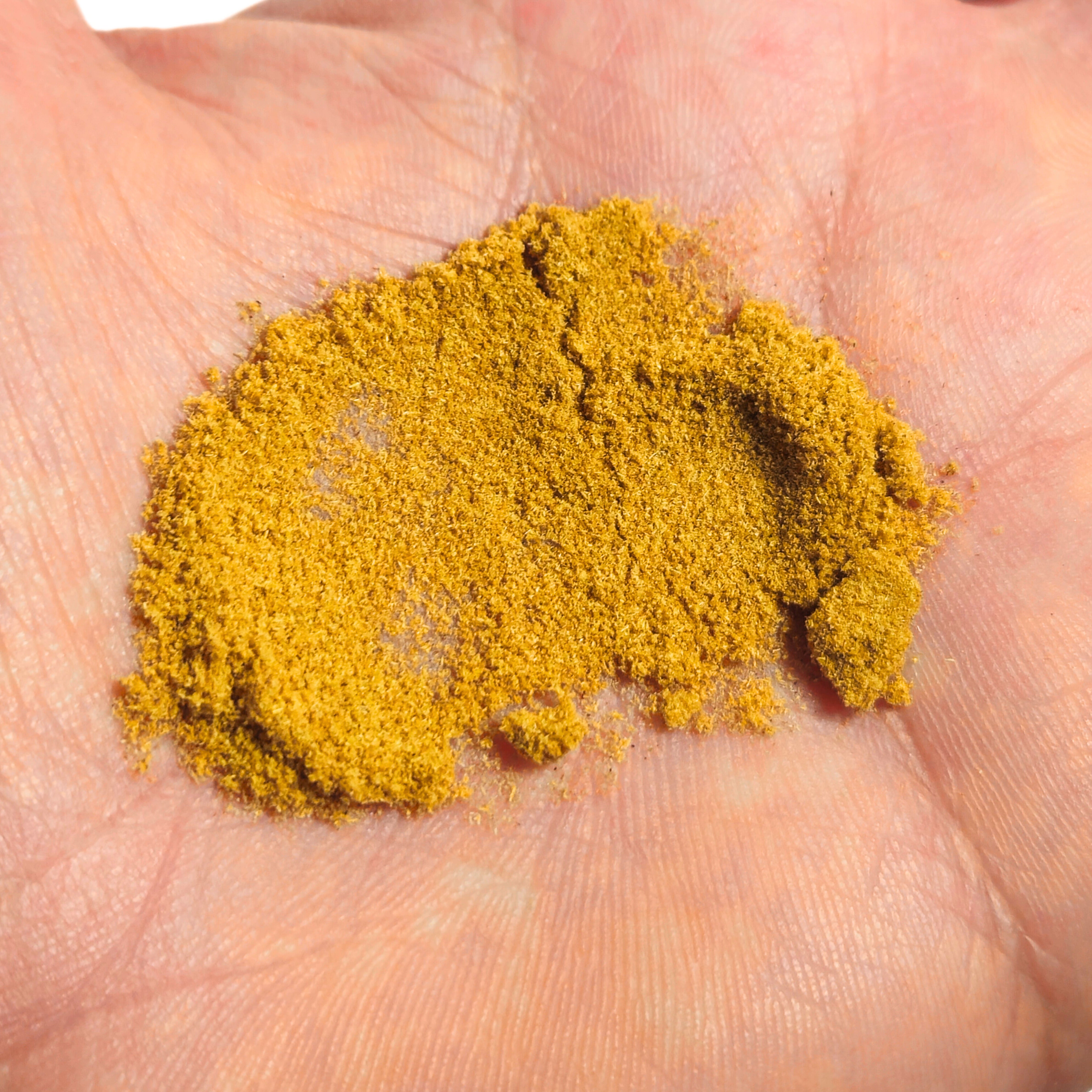 Yellow powder on a person's palm