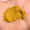 Yellow powder on a person's palm
