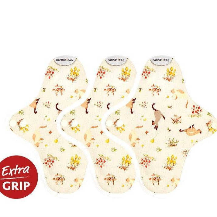 Hannah reusable pantyliner in kitten beige organic cotton print, shown flat with non-slip silicone backing