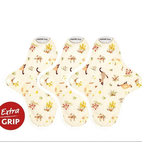 Hannah reusable pantyliner in kitten beige organic cotton print, shown flat with non-slip silicone backing