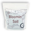 Package of 'Bloomin' Soil' with floral design and branding on a white background