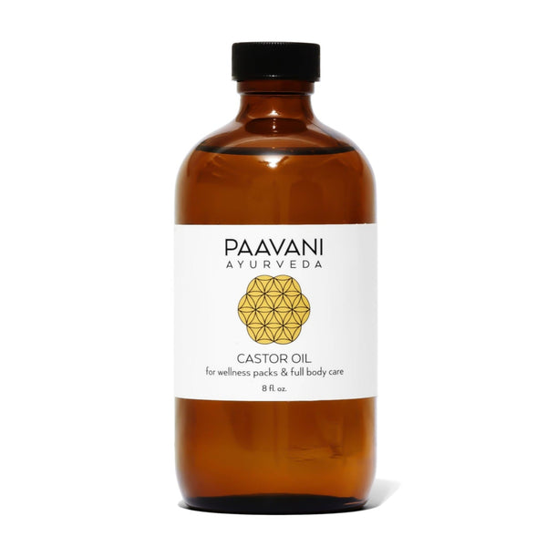 Brown bottle of Paavani Ayurveda Castor Oil with a white label on a white background