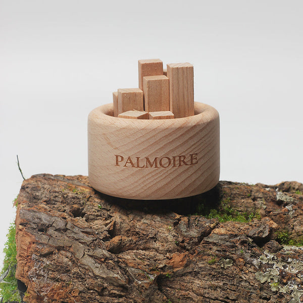 Wooden puzzle set with 'Palmoire' branding on a natural wood background