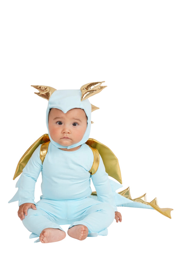 Baby in a dragon costume with gold accents on a white background