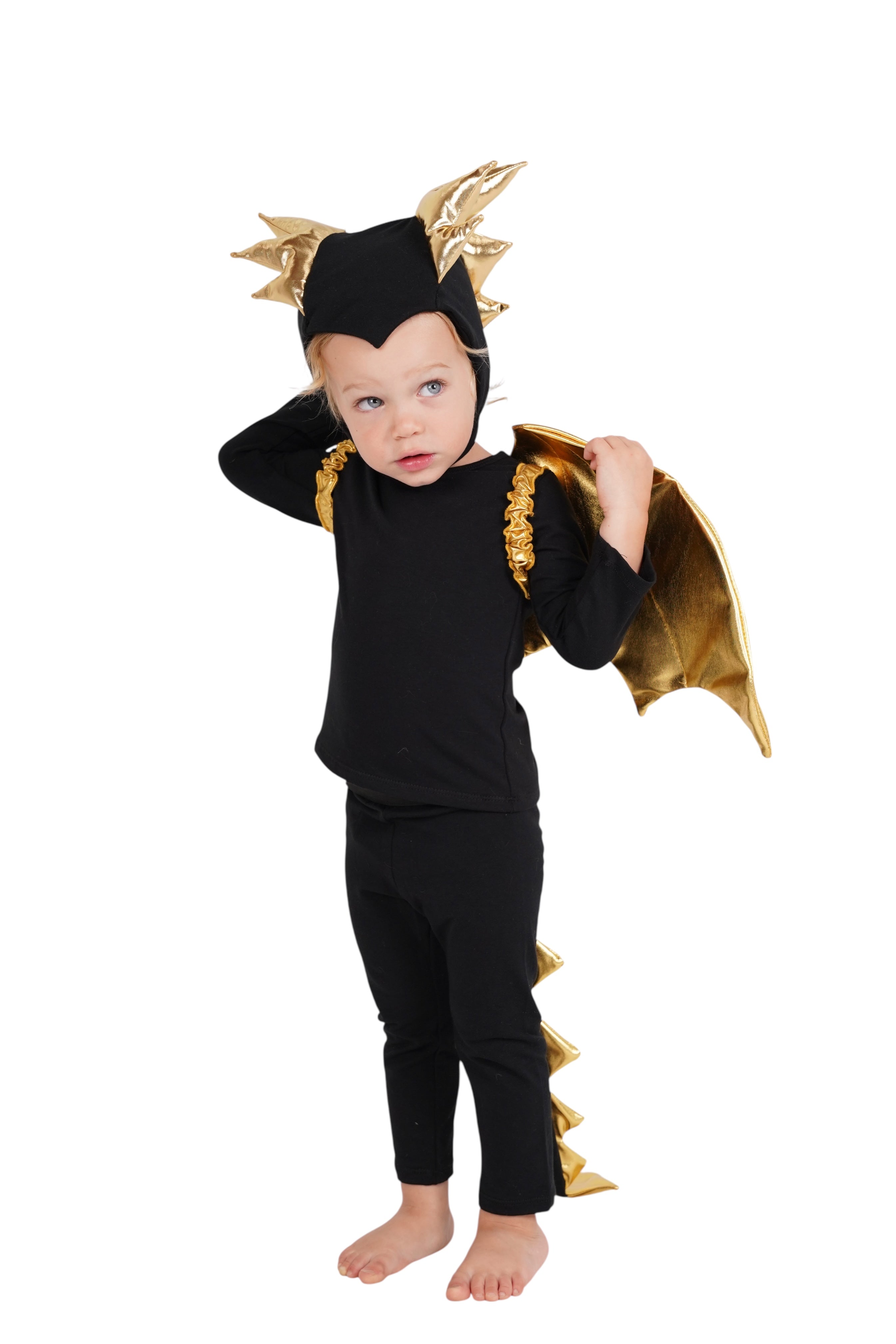 Child wearing a black and gold dragon costume on a white background