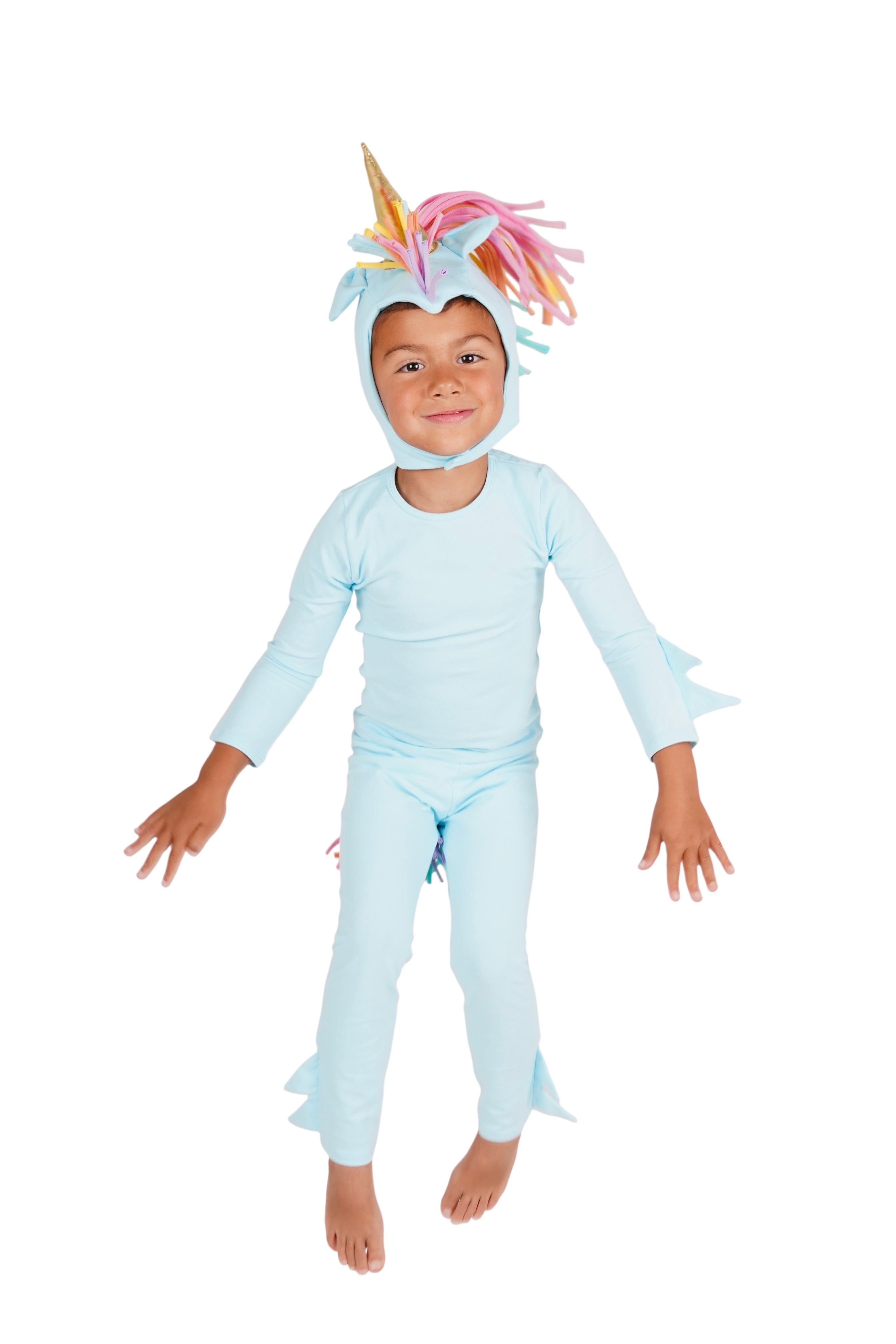 Child wearing a light blue unicorn costume on a white background