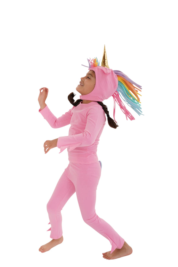 Child wearing a pink unicorn costume with a rainbow mane on a white background