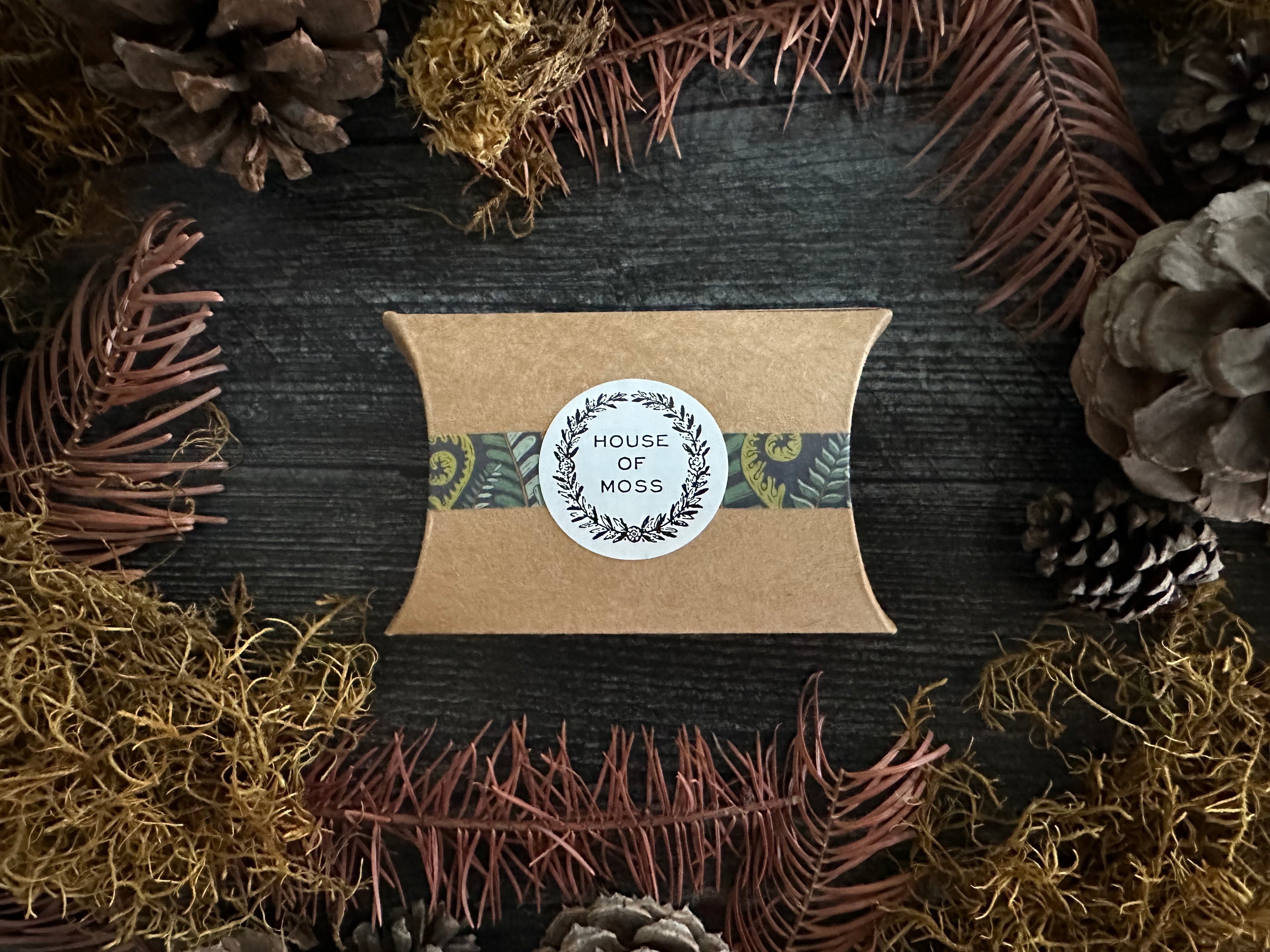Marionberry Red felted wool hearts shown with House of Moss gift packaging