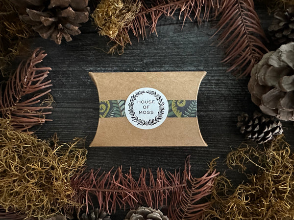 Marionberry Red felted wool hearts shown with House of Moss gift packaging