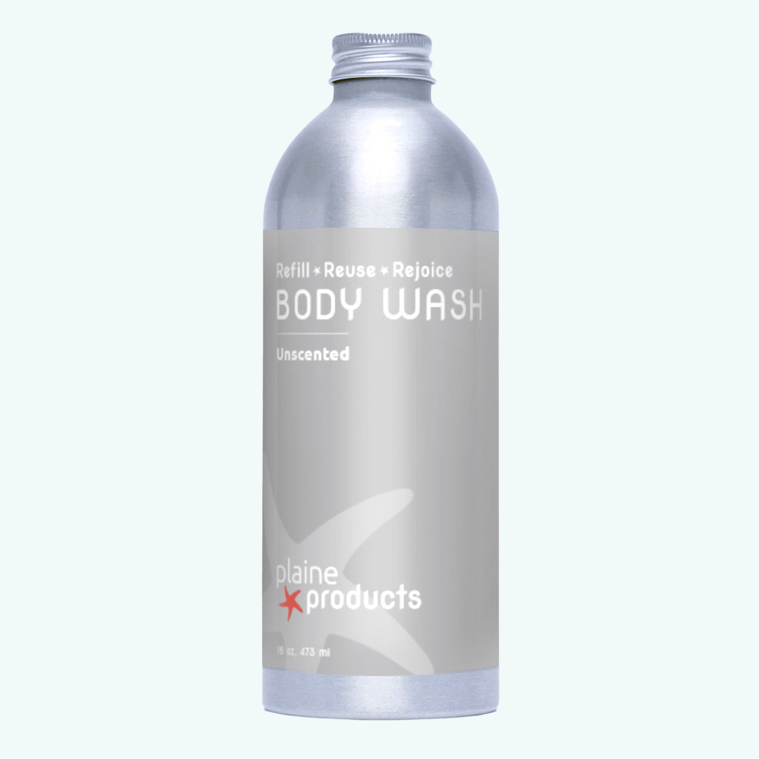Plaine Products body wash bottle on a white background