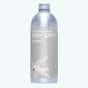 Plaine Products body wash bottle on a white background