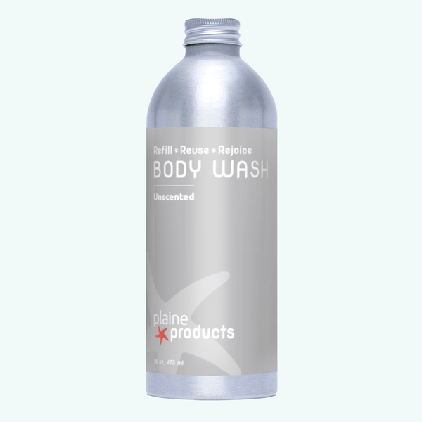 Plaine Products body wash bottle on a white background