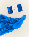 Close-up of Sarah's Silks primary colour playsilks showing vivid natural silk fabric texture