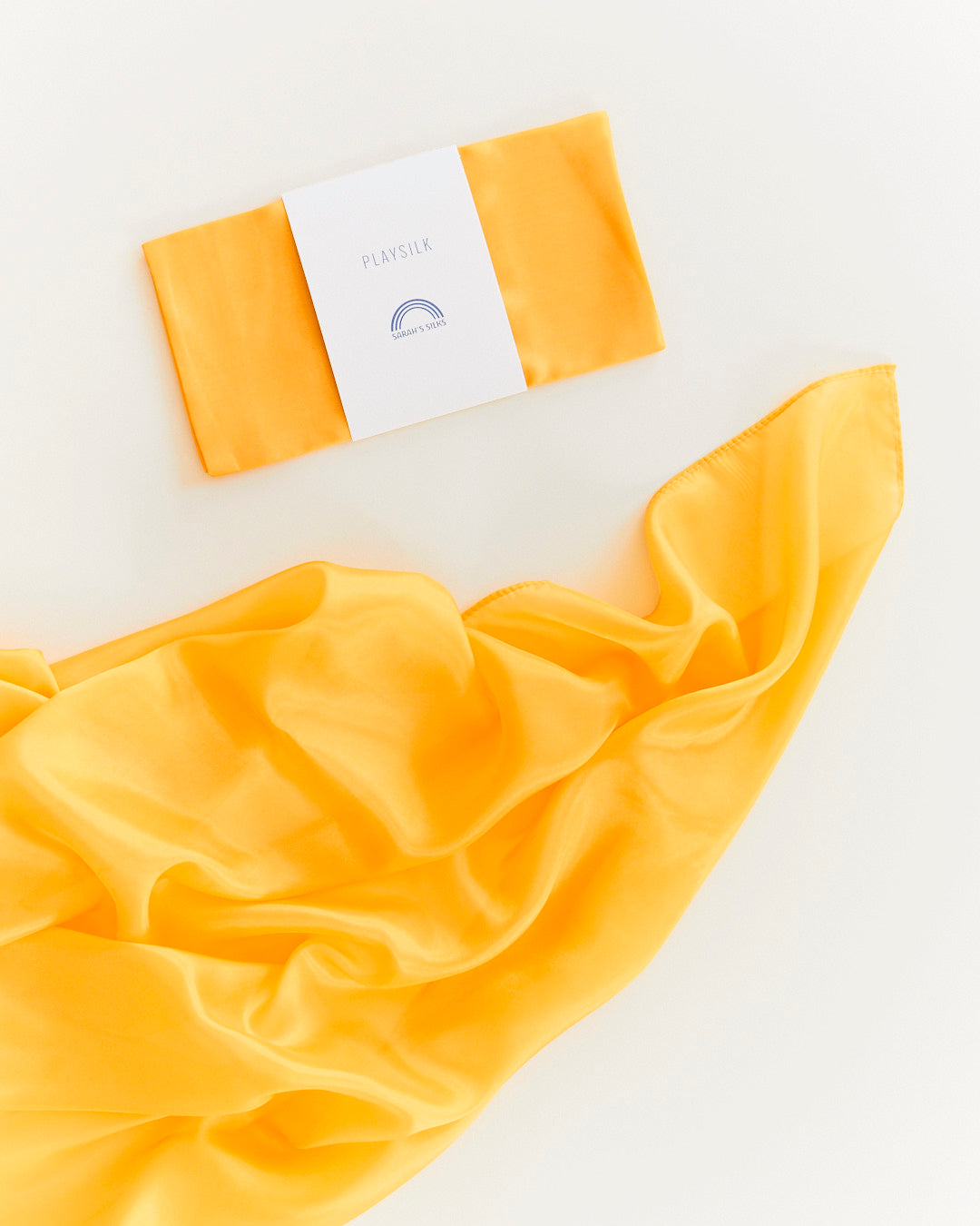 Yellow fabric with a brand label on a white background