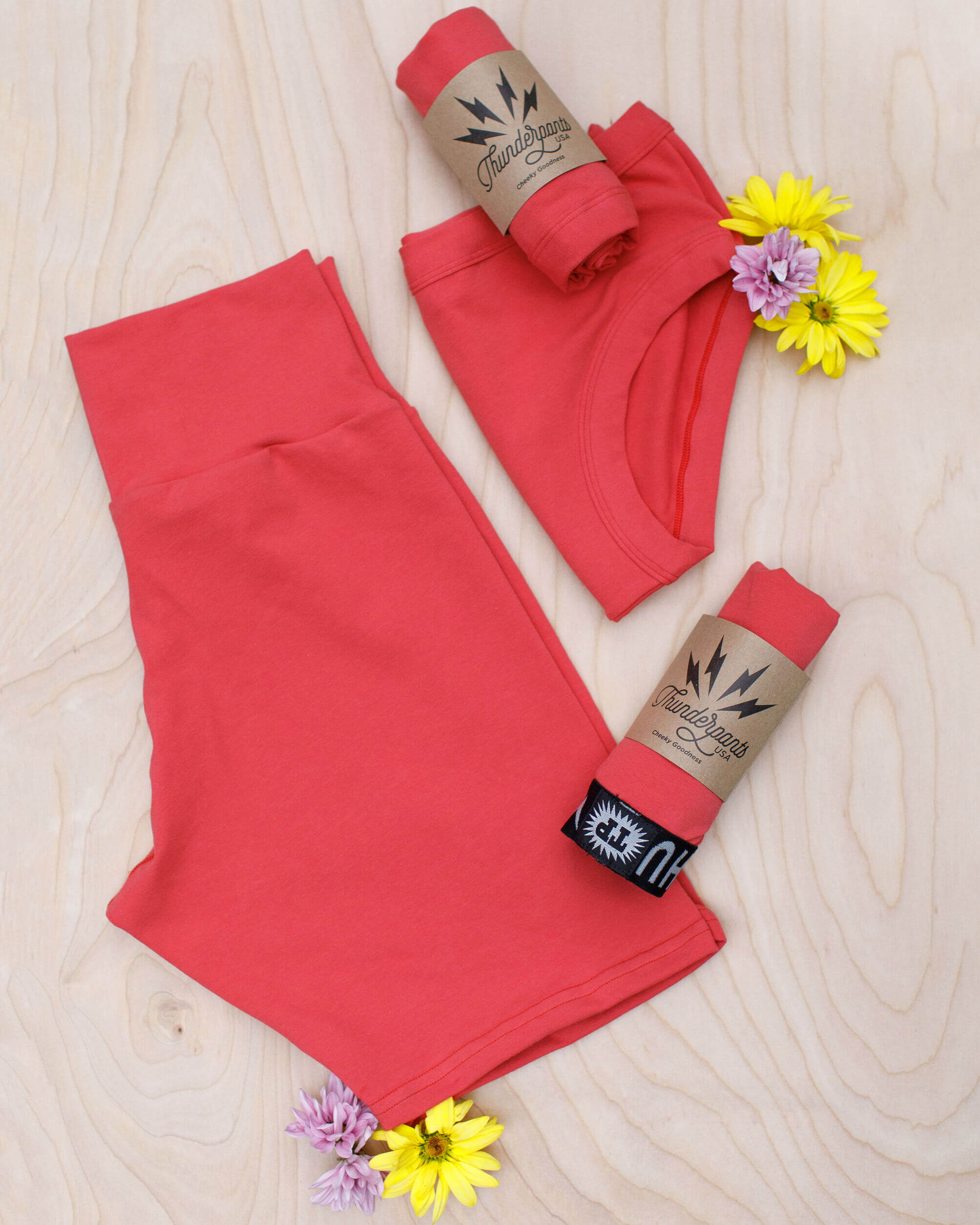 Thunderpants Pomegranate Punch Bike Shorts flat lay showing limited-release coral-pink colour