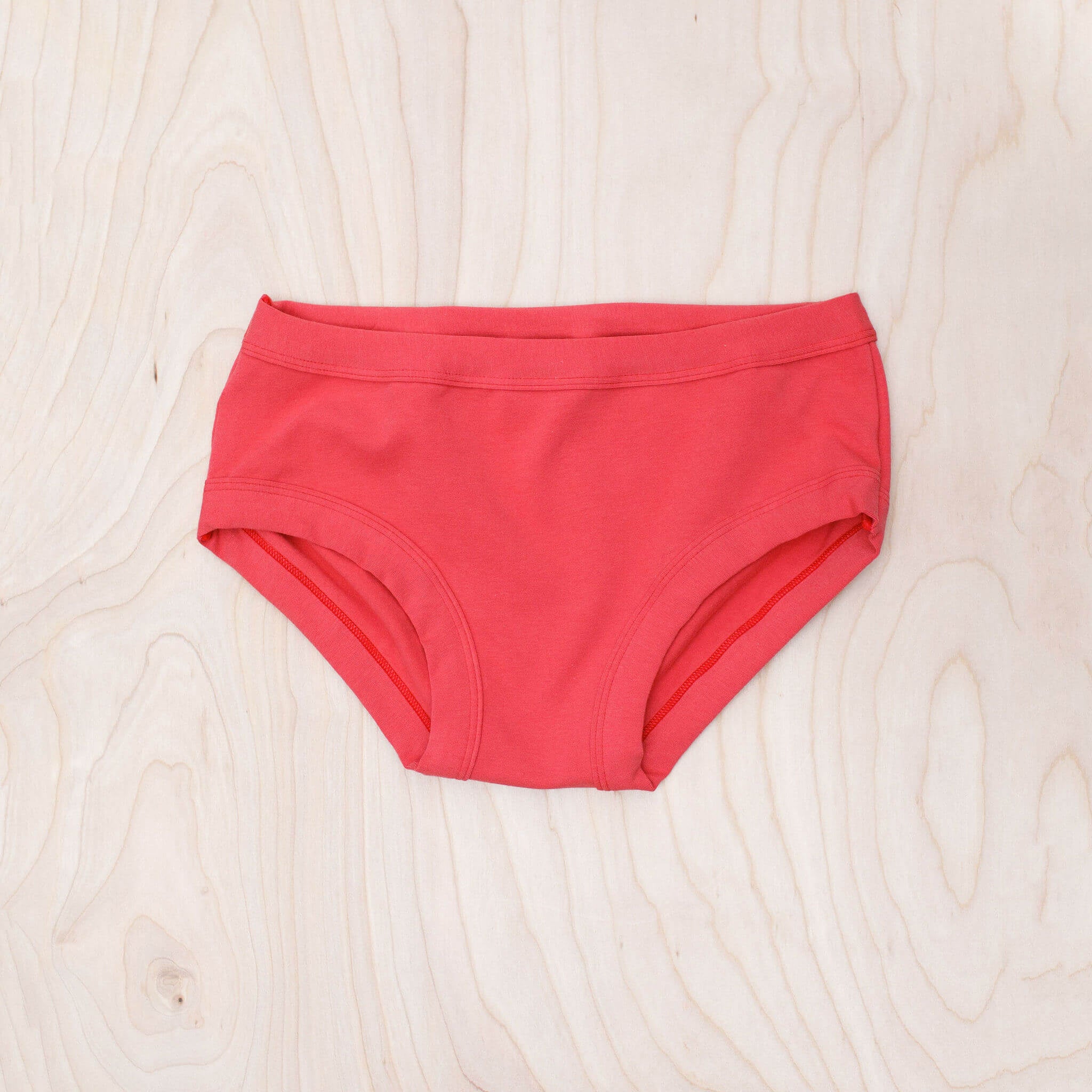 Woman wearing Thunderpants Pomegranate Punch Women's Hipster underwear, side view