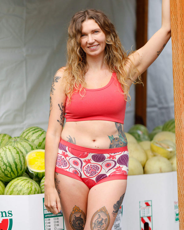 Model wearing Thunderpants Longline Bra in Pomegranate Punch, front view, size Medium