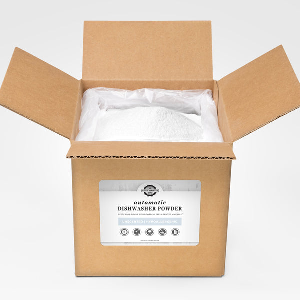 Open cardboard box with dishwasher powder inside on a white background