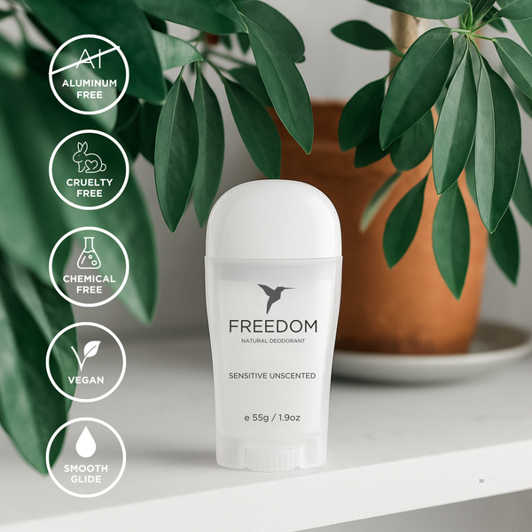 Freedom natural deodorant bottle with green leaves in the background