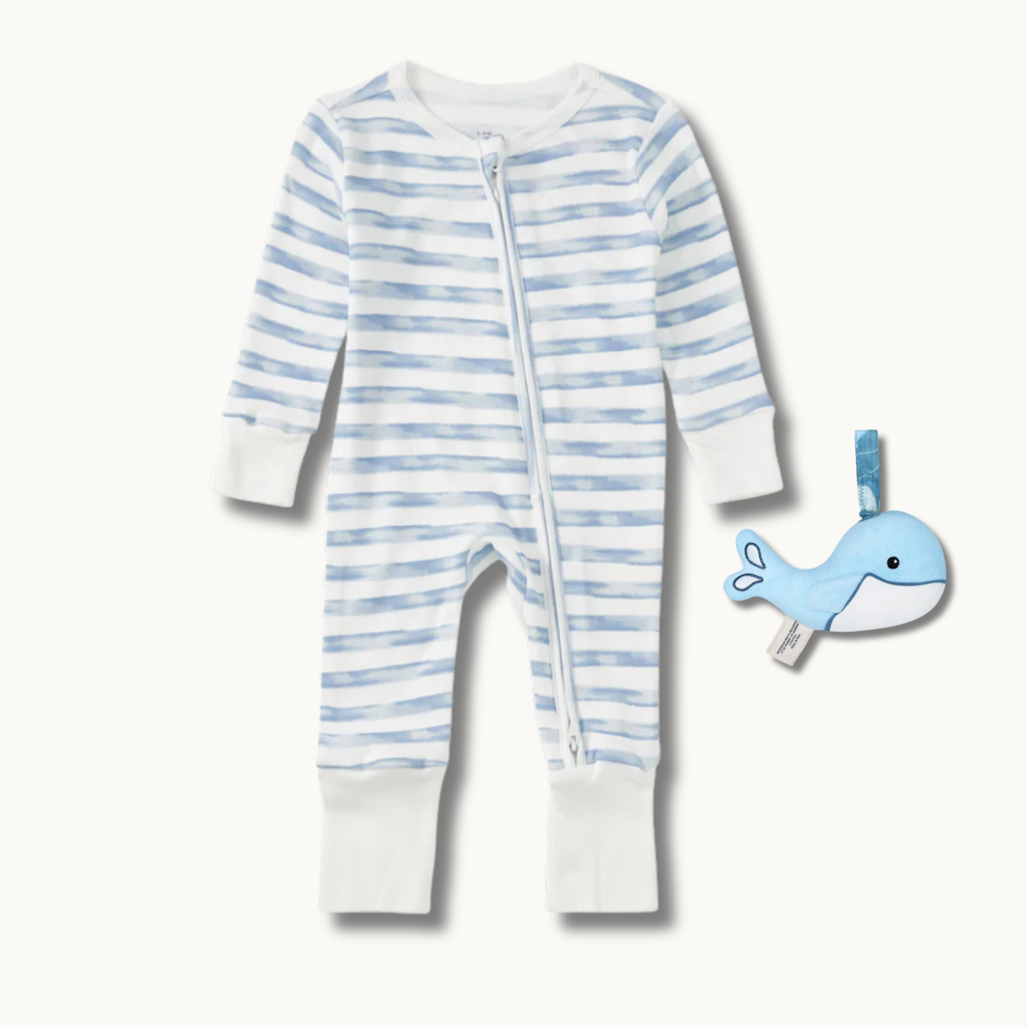 Apple Park Breezy Bay Stripe convertible baby coverall and organic sherpa whale teething rattle gift set on a flat lay background