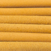 Close-up of yellow cylindrical objects with a textured surface