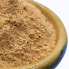 Close-up of brown powder in a ceramic container