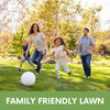 Family and dog playing on a healthy green lawn grown with RUFF & TUFF! grass seed