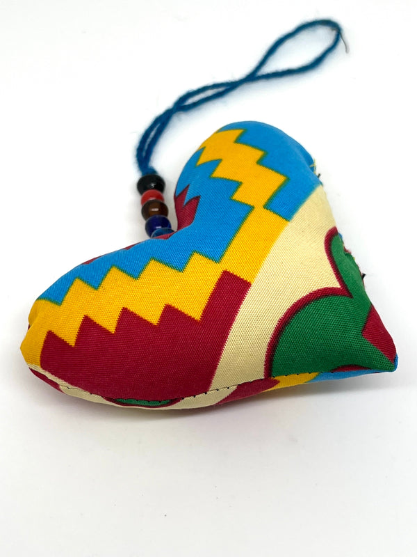 Handmade heart-shaped African wax print ornament with recycled glass bead detail