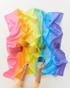 Child playing with Sarah's Silks Rainbow Playsilk, natural silk open-ended toy in rainbow colours