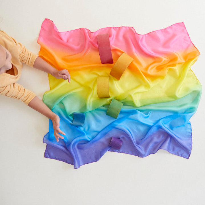 Sarah's Silks Rainbow Playsilk draped and displayed showing full vibrant rainbow colour gradient