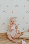 Rainbows and ice cream muslin flutter sleeve romper shown alongside sweet crinkle blankies