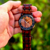 Close-up of custom engraving on the back of a personalized wooden watch
