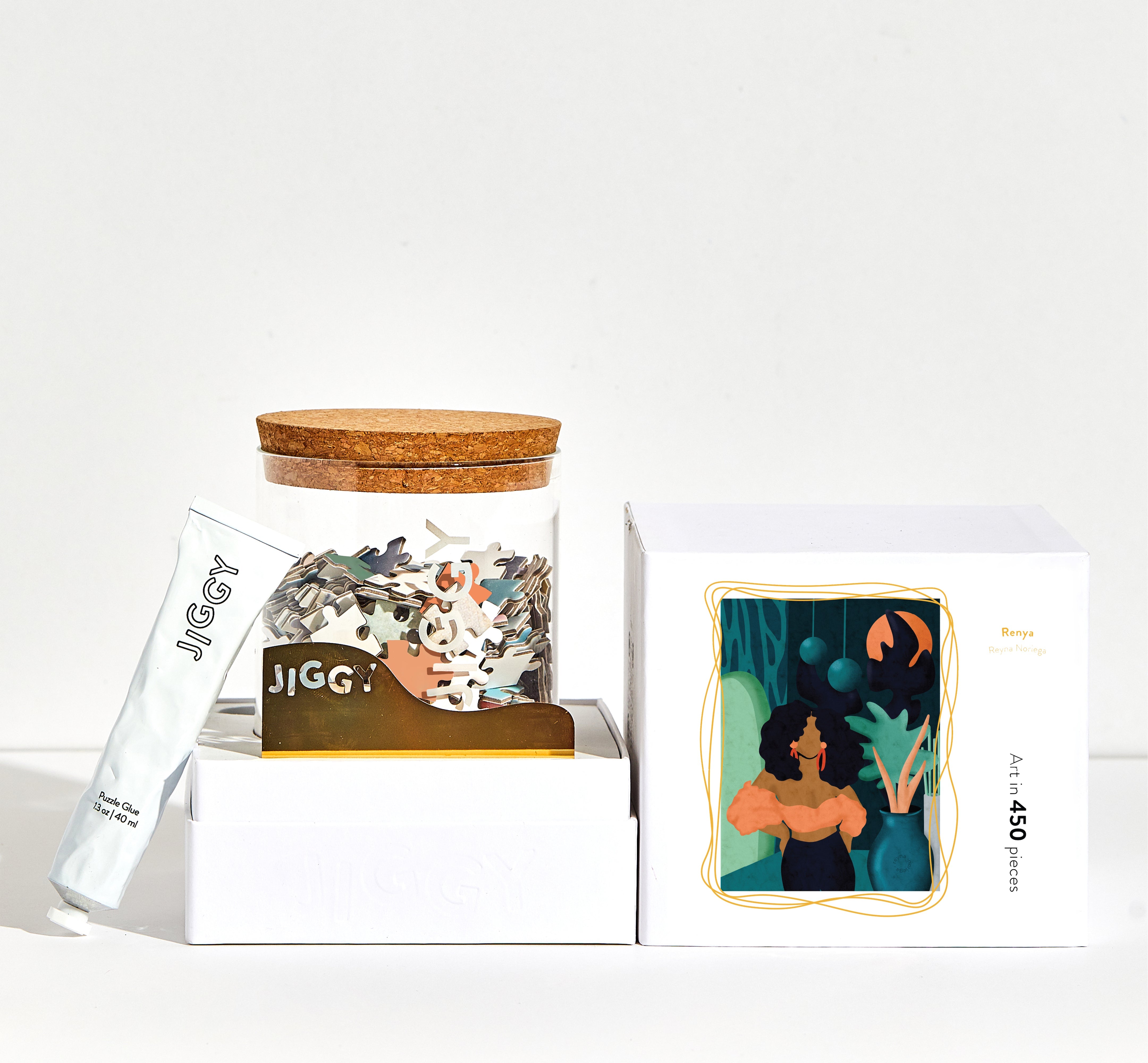 JIGGY puzzle packaging with a cork lid on a white background
